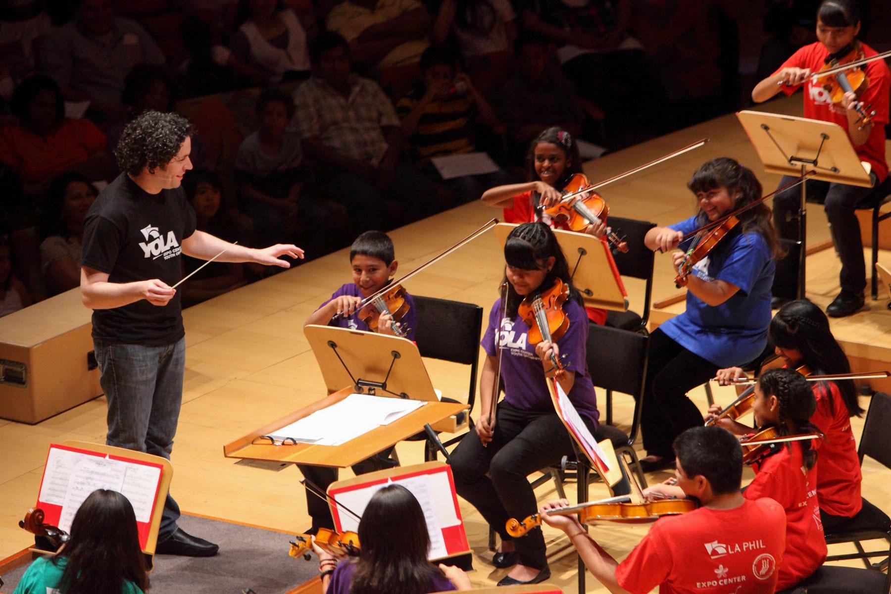 How does music affect the kid's development?